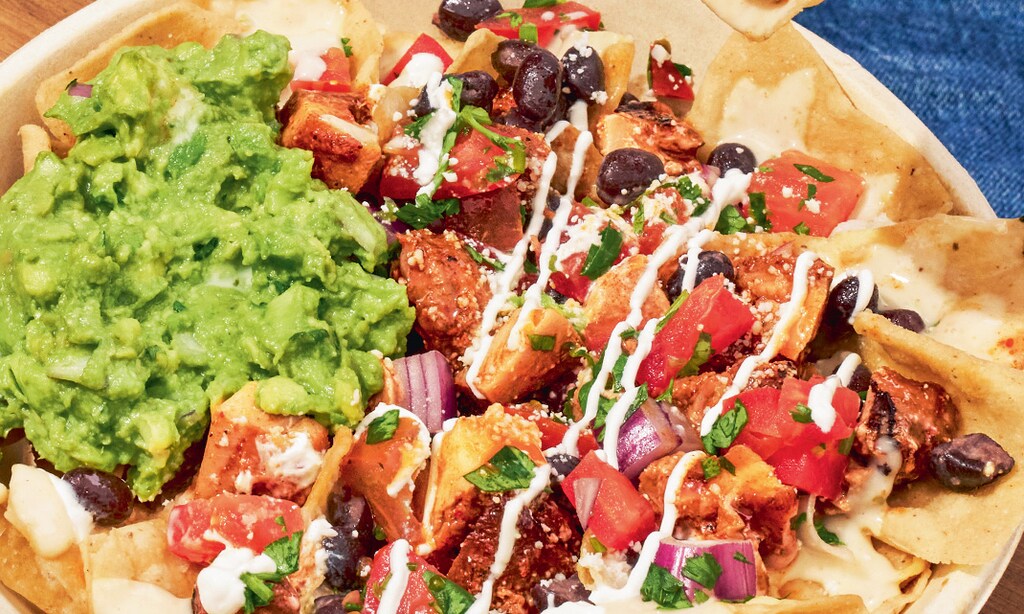 Product image for QDOBA MEXICAN EATS FREE Chips & Queso with any entree purchase. 